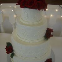 First Time I picked up all three of Sharon Zambito's cake decorating vidoes and was able to make this wedding cake after watching the buttercream...