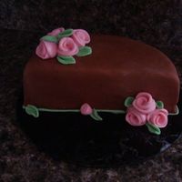 Fondant Practice This was just a practice cake for me to work with fondant more! It was my first time experimenting with the "duff style" roses....