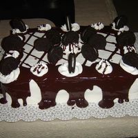 Cookies-N-Cream Cookies-n-creme cake with buttercream icing and chocolate ganache.