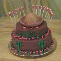 Fiesta This is a chocolate cake with chocolate buttercream icing made for a Mexican/Fiesta themed birthday party. The sombraro and peppers are...