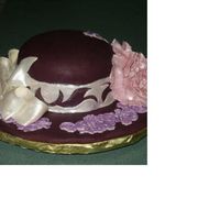 Purple Widebrim Hat Cake is covered in fondant and everything else is either fondant or mixed fondant/gumpaste. You can' t see the side, but I raised/...
