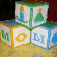 Cross Stitched Blocks MMH and then plastic canvas to give the look of cross stitch. Very difficult cake to do.