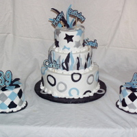 3 Tierd Black And Blue For Two This is a three tied cake with two side cakes made out of red velvet. Buttercream icing and fondants decorations. Some of the decorations...