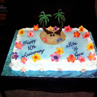 Hawiian Theme full sheet cake with royal icing flowers and chocolate transfers