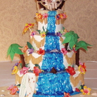 Hawiian Themed make it big, make it bold with lots of stuff and lots of color. The cake toppers is made out of fondant and gum paste my first attempt at...