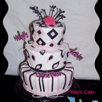 Black White And Pink Tier This is a three tier chocolate Carmel pecan cake iced with butter cream with fondant and chocolate accents