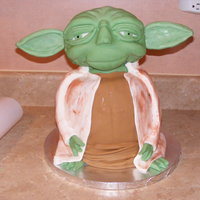 Yoda Cake I made this for a group my DH and I belong to that dress as Star Wars characters. We put a santa hat on him, and he was Santa Yoda.