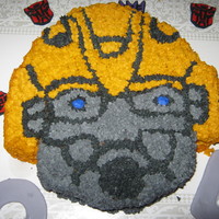 Bumblebee We could not find a bumblebee cake pan, so we had to improvise. We took a coloring page off line, blew it up, and cut it out of the paper....