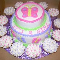 Baby Shower Cake This is a 9" 2 layer cake with a 1 layer 6" on top. I put cupcakes around the cake for a little more decoration. The lady who...