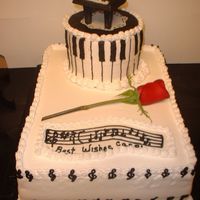 Retirement Cake For Pianist Co-Worker Piano is a solid chocolate mold sitting on a chocolate plaque. G-clefs also in chocolate...rest is buttercream. I wish I had done the black...