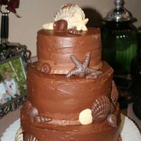 Chocolate Sea Shell Wedding Cake This is a yellow cake with raspberry cream filling and chocolate icing. A very big compromise on the fact that the cake was chocolate, but...