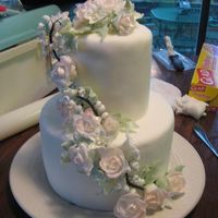 Spring Wedding Cake This is a spring themed dummy wedding cake that is for a bridal expo coming up. Styrofoam cake covered in fondant, with gum paste flowers....