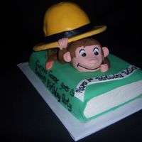 Curious George This is my first attempt at a Curious George cake. The book and the hat are yellow cake. George is RKT. The hat was made with the...
