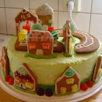 119714876357811.jpg This is a chocolate cake with buttercream icing and is for my stepson's 5th birthday. Thedecorations are made of gingerbread cookies...