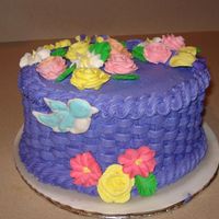 Wilton Course Ii Final This was my first basket. My 8 year old took the class with me and she helped. The flowers are royal and the birds are color flow.