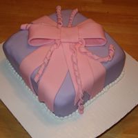 Fondant Present Yellow cake with strawberry cream filling. This cake was my first attempt at fondant with the Wilton course. The fondant is flavored with...