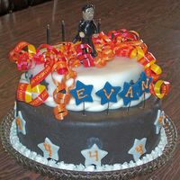 Johnny Cash My nephew's birthday cake. Sculpey figure, doctored choc. cake with choc. buttercream, fondant with gumpaste stars.