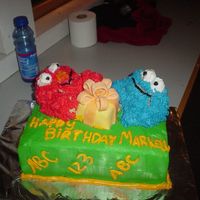 Birthday Cake Disaster I made this for a friend and about an hour after I made it Elmo and Cookie Monster started falling apart. They were made from Rice Krispie...