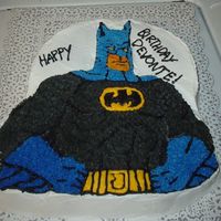 Batman I work at a residential treatment center for children who may not have families and have behavioral problems. It is a yellow cake iced in...