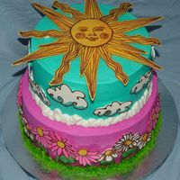 Sun And Flowers This is my daughter's birthday cake. She chose a design from my WBH book and I tweaked it a little.