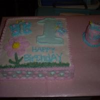 First Birthday Cake With A Small Smash Cake This is my version of a cake my customer found off of CC. I found out I really can't make butterflies very well. Also, the birthday...