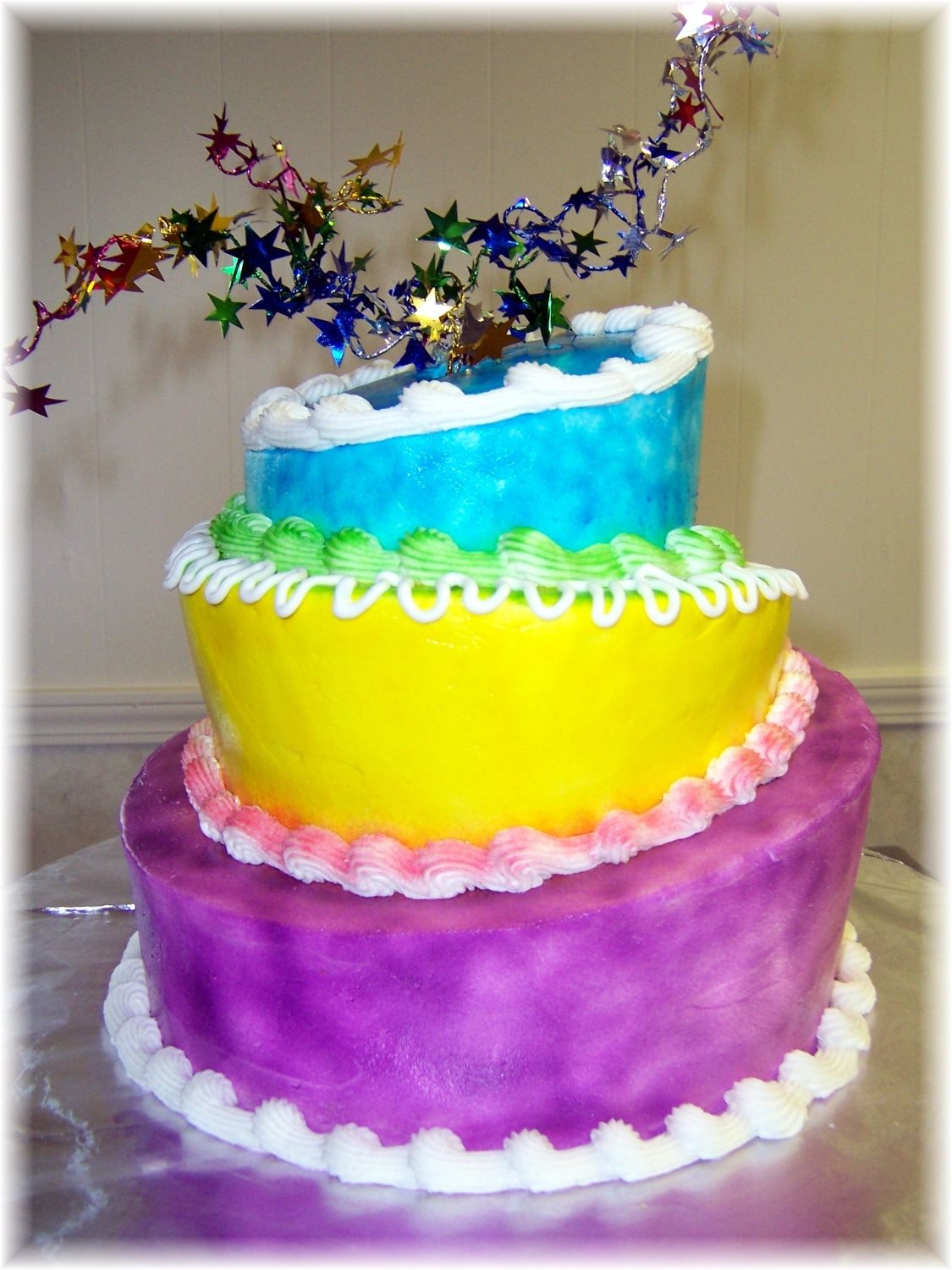 Celebrate Mad Hatter Style buttercream cake with airbrushed color