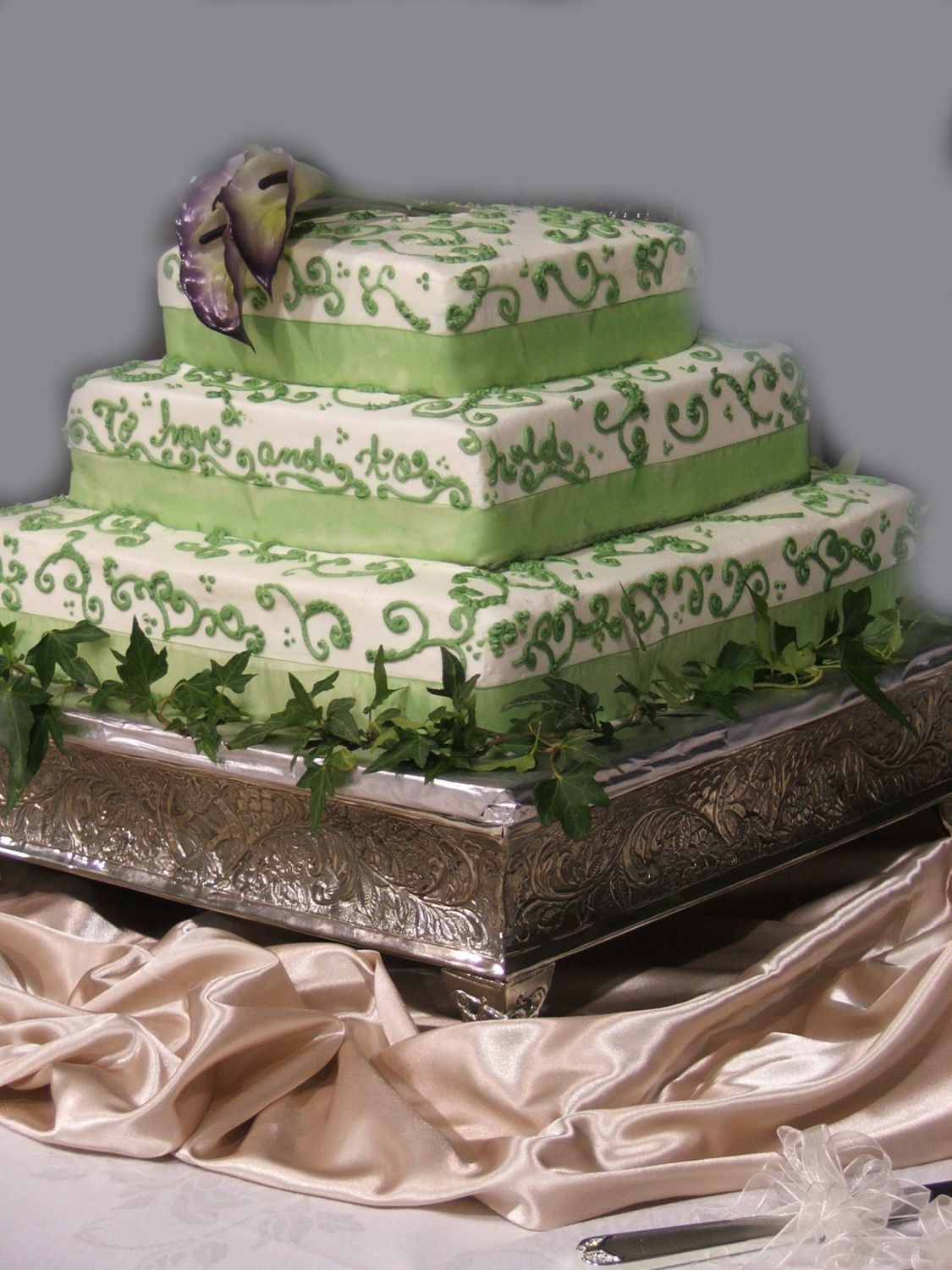 Candice's Wedding Iced in buttercream, with a shear ribbon trim and free-hand scroll work. Inspired by a design from online only I can't remember where...