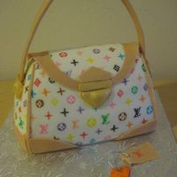 Luis Vuitton Handbag Cake Louis Vuitton Handbag Cake that was auctioned off for a charity. Sold for $900! Every single symbol was hand drawn on - took a LONG time!...