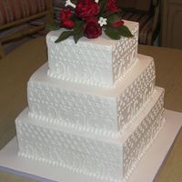Square Wedding Cake With Gumpaste Roses Buttercream covered CASC, White Chocolate Cake and Carrot cakes. Buttercream details and red gumpaste rose topper. These are my test roses...