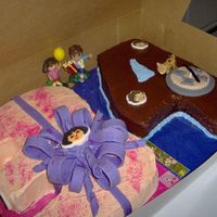 Dora & Deigo Cake Customer really didn't know what she wanted so I just did what I wanted..lolWas my first attempt at a fondant bow, needs much more...