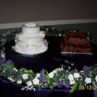 Wedding Cake And Groom's Cake Wedding cake-lemon with buttercream frosting and royal icing roses. Groom's cake-chocolate fudge, chocolate buttercream, chocolate...