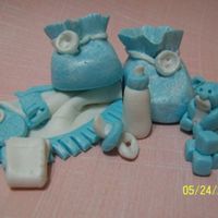 Close Up Of Boy Items On Baby Shower Cake All made from fondant with lusterdust