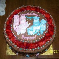 Baby Shower Cake Cake made for two sisters - 1 having a girl, 1 having a boy. Cake is chocolate buttercream and items on top are fondant. Strawberries...
