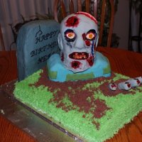 Zombie Cake This is the cake I made for my husbands 40th birthday. He absolutely loves zombies. All of it is cake except for the fingers ,those are RKT...