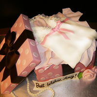 Lingerie Gift Box Cami is cut from fondant. Styrofoam used for lid. Tissue paper is made from gum paste.