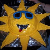 Sun Cake! The sun is a dome shaped cake and the sunglasses and rays are chocolate chip cookies with frosting.