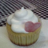 Cupcake Valentines vanilla cupcake - baked alot of them for the school who sold them for valentines day.. American frosting with a fondant heart...