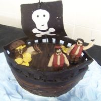 Pirate Ship Had sooo little time to bake this.. the figures didn't dry and the started 2 fall over :p luckily just 4 family.. Choc cake, gumpaste...