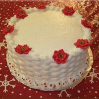 Holiday Cake 2006 Swiss chocolate cake with vanilla buttercream. The iridescent cake sparkles on top give it a "snowy" look.