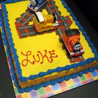 Thomas The Train Buttercream with fondant accents. Trains are toys.
