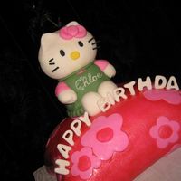 Chloe's 1St Birthday White, pineapple filling cake iced with BC and covered in fondant embellished decor to match Hello Kitty theme.