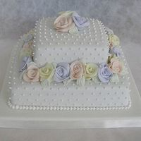 A Square Wedding Cake With Roses 