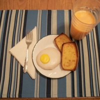 April Fool's Breakfast Sugar cookie fried egg, pound cake was sliced, buttered, sprinkled with brown sugar, and toasted in the oven. Milk colored orange to look...