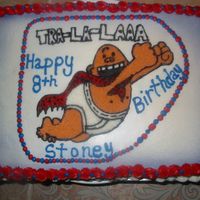 Captain Underpants Captain Underpants traced by hand on wafer paper. Half Chocolate and Half White Cake put together and covered in buttercream. Airbrushed...