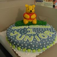 Winnie The Pooh Cake Cake was made for a friend's son's first birthday. Very scary for me because it was my first time to mold a figure out of fondant...