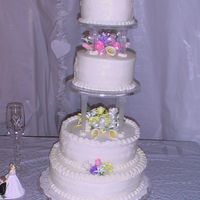 Rosch_Wedding.jpg White cake on top & bottom Chocolate cake in middle. Gumpaste roses