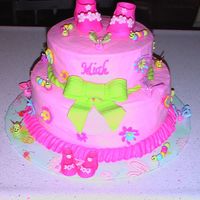 Baby Cake Shoes, bow, bugs & butterfly wings made from fondant. Butterfly bodies made from royal icing. Top layer chocolate. Bottom layer white...