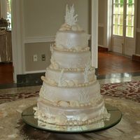 Beach Wedding Cake 5 Tier, 3 Flavor wedding cake in a beach/coral theme. Flavors included champagne cake with strawberry filling, choc/mint cake with choc...