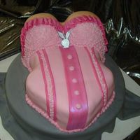 Pink Bustier Birthday Cake Birthday cake for some lucky gentleman. Wife wanted huge boobs and the playboy logo incorporated somewhere. Got 2 more cake orders out of...