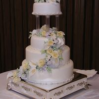 Kaitlyn's Cake My granddaughter's wedding cake. 6", 8", 10" and 12" tiers. Rolled fondant., fondant lace and edible pearls. My...